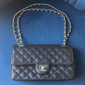 CHANEL Quilted Black Shoulder Bag with Silver Chain